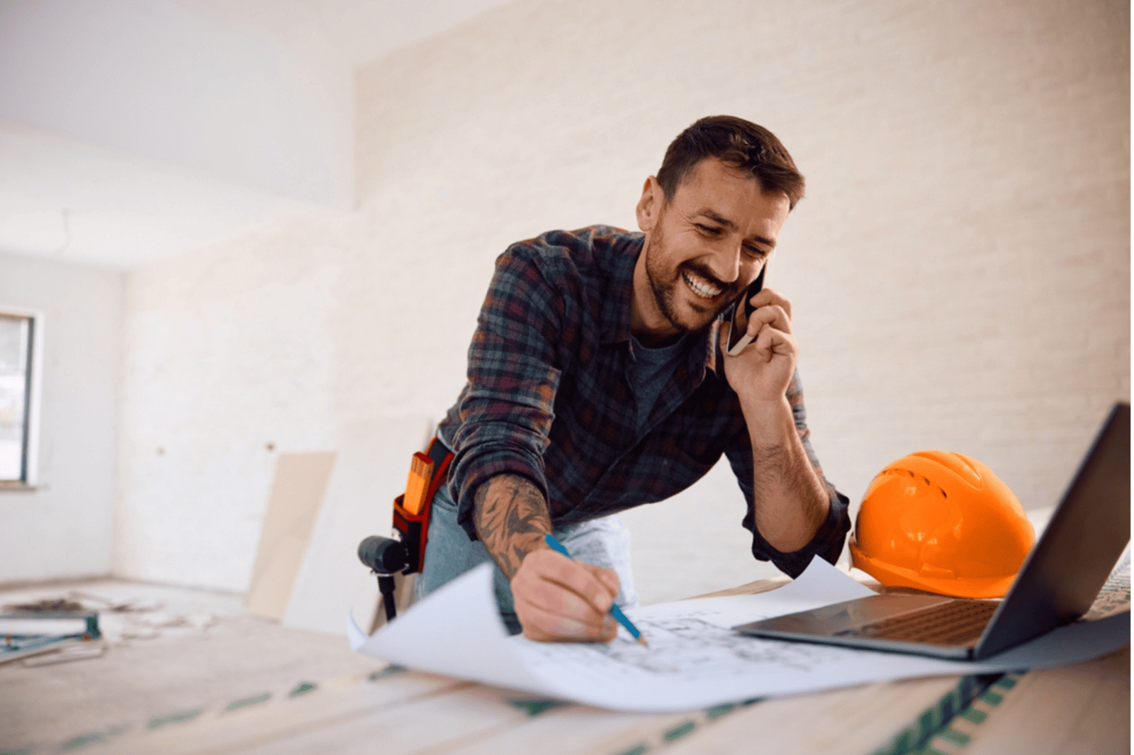 Construction contractor looking over plans