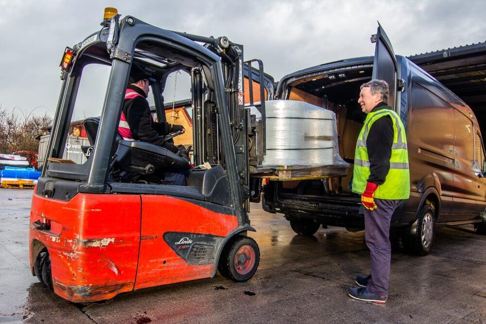 Courier Van being loaded by Forklift