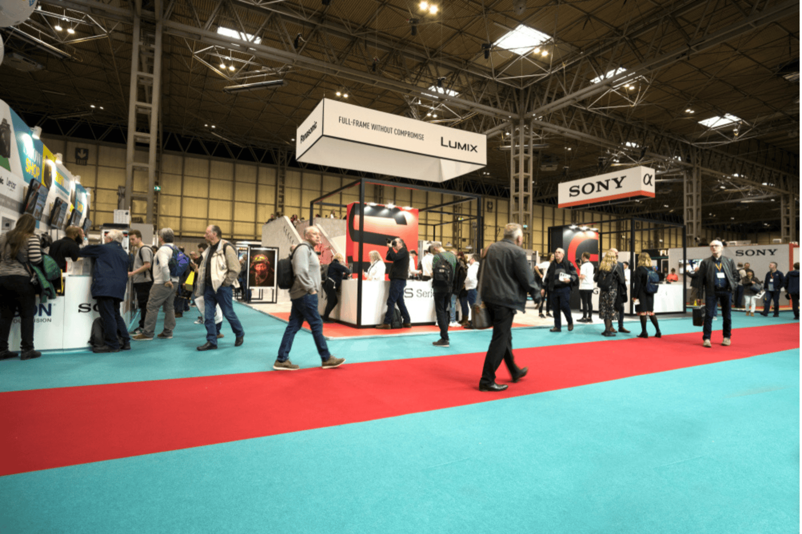 An exhibition hall with visitors walking around