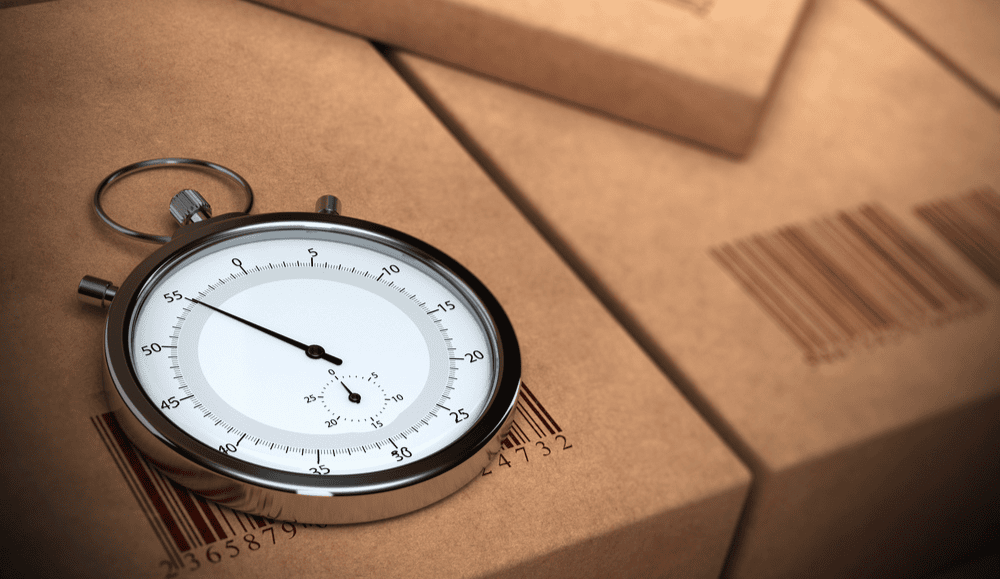 A stopwatch on a box with a barcode