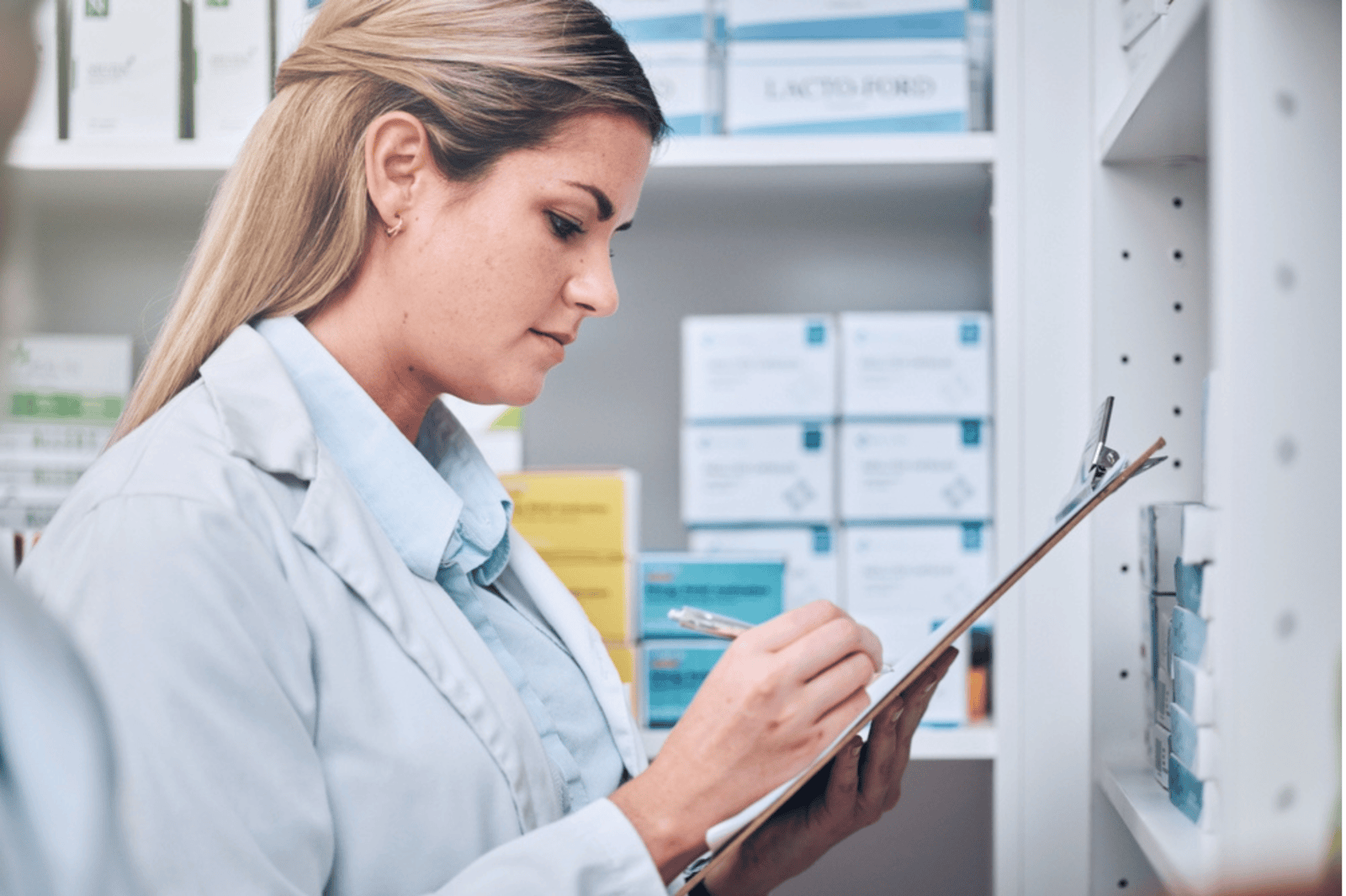 A pharmacist checking stock